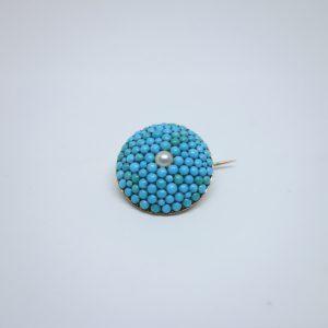 broche or et turquoises