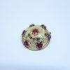 broche or et grenats