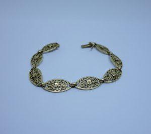 bracelet or maille olives ajourés et motifs de fleurs