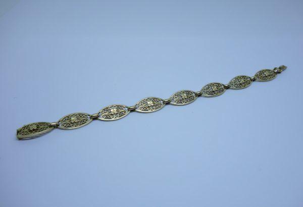 bracelet or maillon olive ajourés et motifs de fleurs