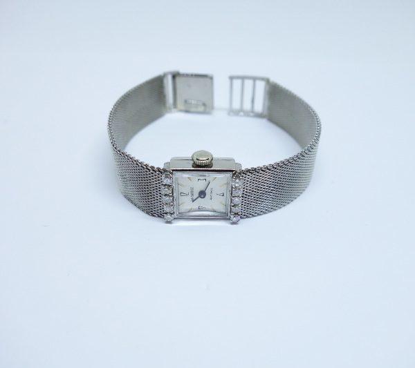 montre femme or gris et diamants