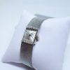 montre femme or gris et diamants