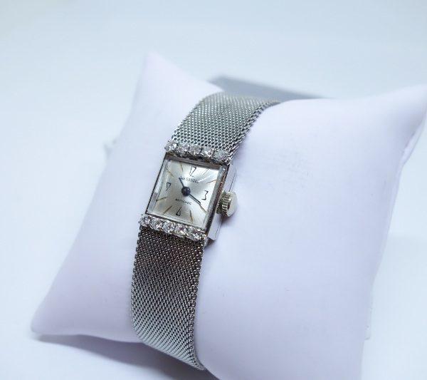 montre femme or gris et diamants