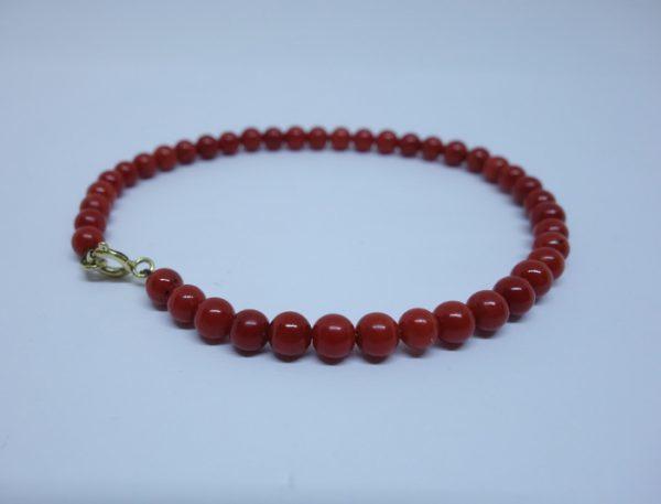 bracelet or et boules de corail rouge