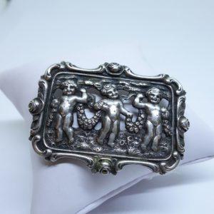 broche argent avec chérubins