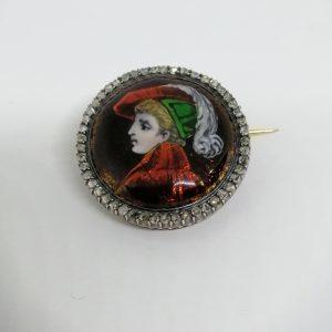 Broche ronde or/argent