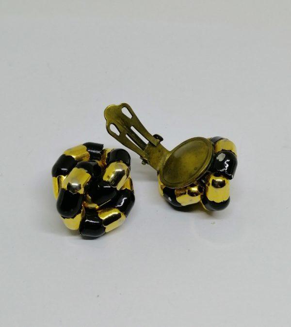 paire de boucles d'oreilles en métal jaune noir et or 1930