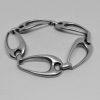 bracelet argent maillon ovale ajouré et courbe bijou français vintage vers 1960-70.