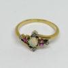 bague en or rose, avec opale , rubis et roses de diamants vers 1900