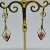 boucles d'oreilles en or bicolore pendantes art déo