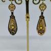 boucles d'oreilles pendante en or bicolore vers 1870