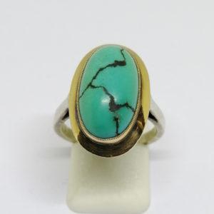 bague argent/or, avec cabochon de turquoise matrix vers 1925.