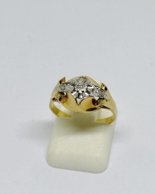 bague en or bicolore avec petit diamant vers 1920.