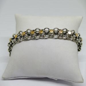 bracelet argent avec maillon creux et pastille d'or vers 1900.