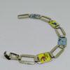 bracelet argent maillon rectangulaire et émaillé de fleurs vers 1925.