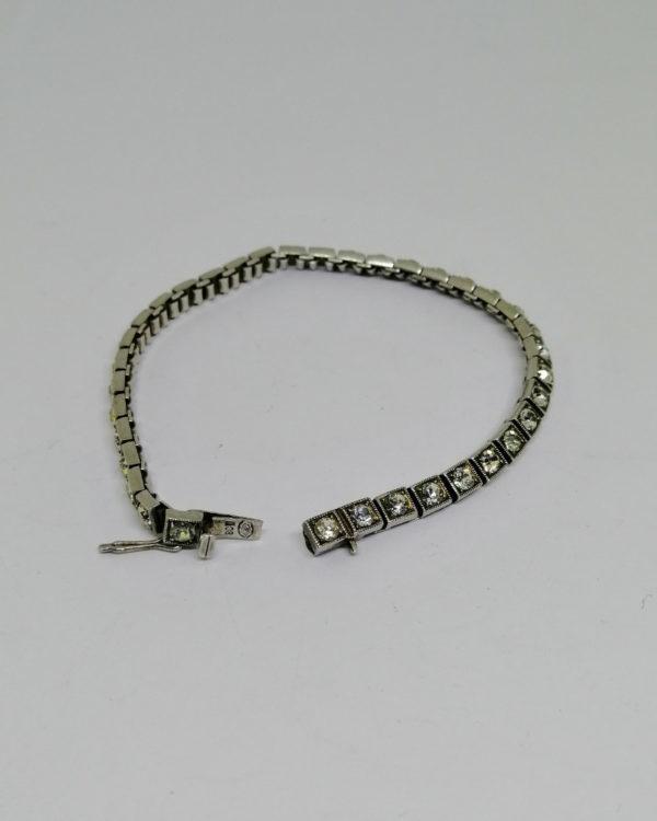 bracelet argent avec sertie de pierres façon rivière vers 1930.