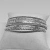bracelet argent semainier avec décors végétaux et frises, vers 1920.