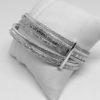 bracelet argent, semainier avec décors végétaux et frises vers 1920.