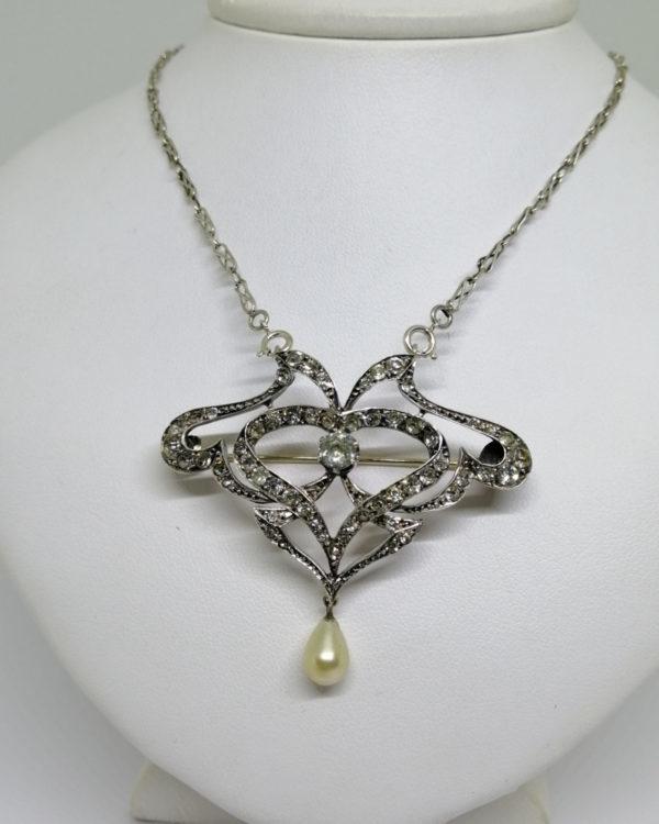 broche/collier argent avec pavage de pierres blanche et en pampille une perle d'imitation en goutte, époque 1880-1900.
