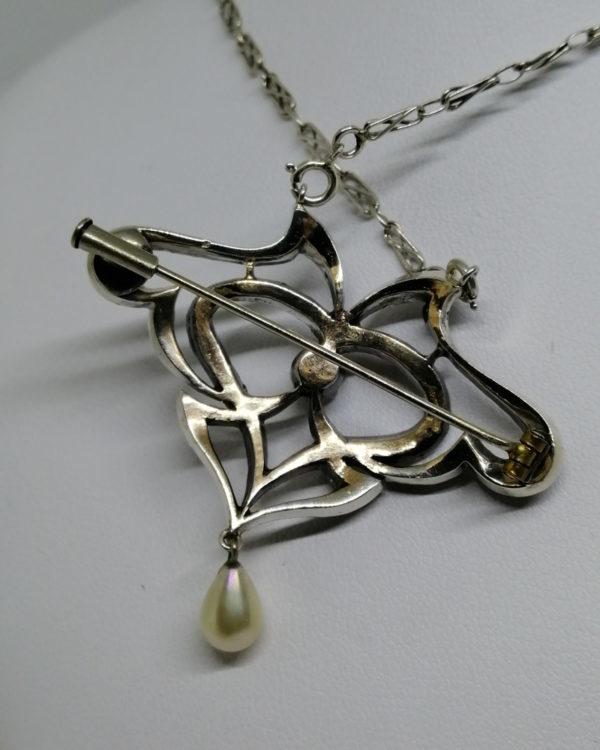 broche/collier en argent avec pavage de pierres blanche et en pampille une perle d'imitation en goutte art nouveau vers 1880-1900.