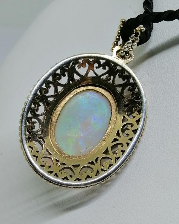 pendentif argent, vermeil avec gros cabochon d'opale vers 1930-40.