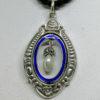pendentif argent avec cerclage en émail bleu, et pampille avec perle baroque et marcasites , 1900.