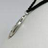 pendentif argent avec émail bleu et pampille avec perle vers 1900.