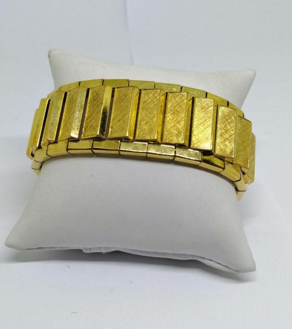 Gros bracelet souple en métal jaune doré, de la Marque Amérikaner, 1940-50.