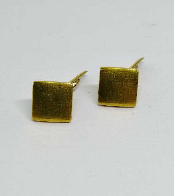 Boutons de manchettes avec décor imprimé, vers 1920.