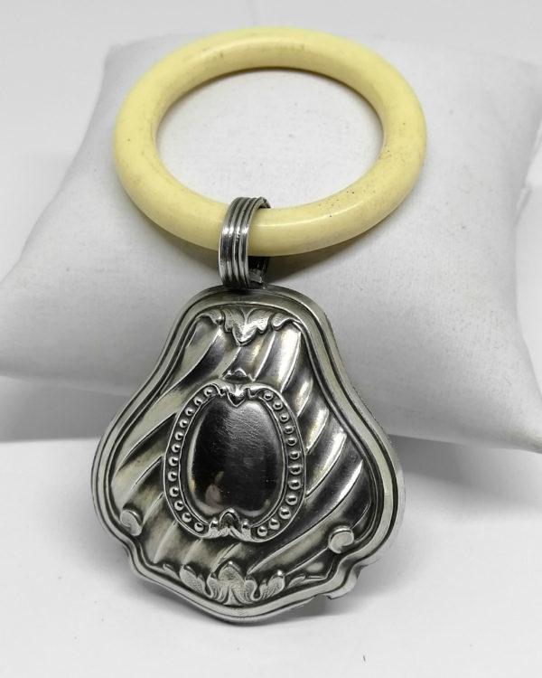 Hochet argent pour bébé, façon cloche.