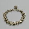 Bracelet argent, maille plate ajourée et bicolore, avec breloque, Paris.