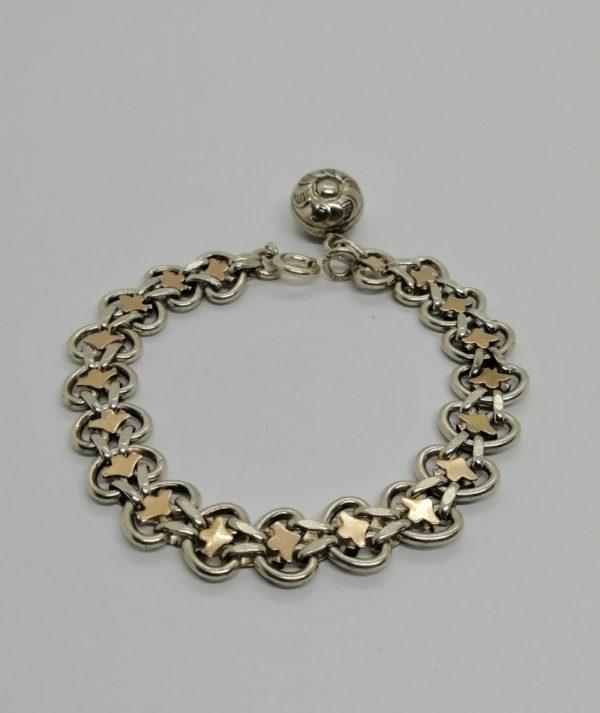 Bracelet argent, maille plate ajourée et bicolore, avec breloque, Paris.