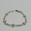 Bracelet argent, maille original et goupillon, vers 1920.