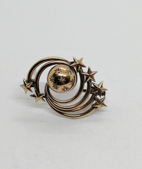 Broche or/argent façon planète, et étoiles filantes.