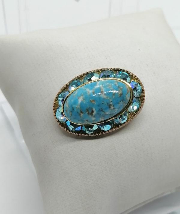 Broche en laiton couleur bleu turquoise.