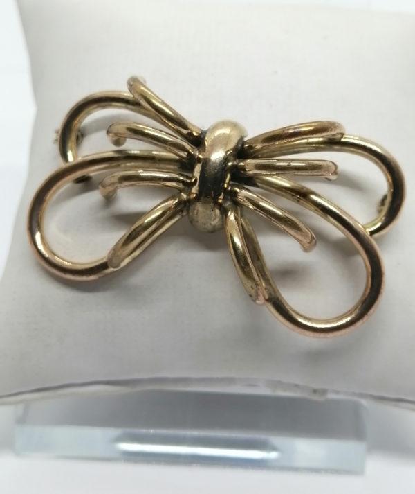 Broche en tubes de laiton jaune, façon arraignée.