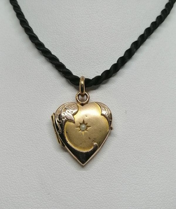 Pendentif, porte-photo de forme coeur, en plaqué or rosé.
