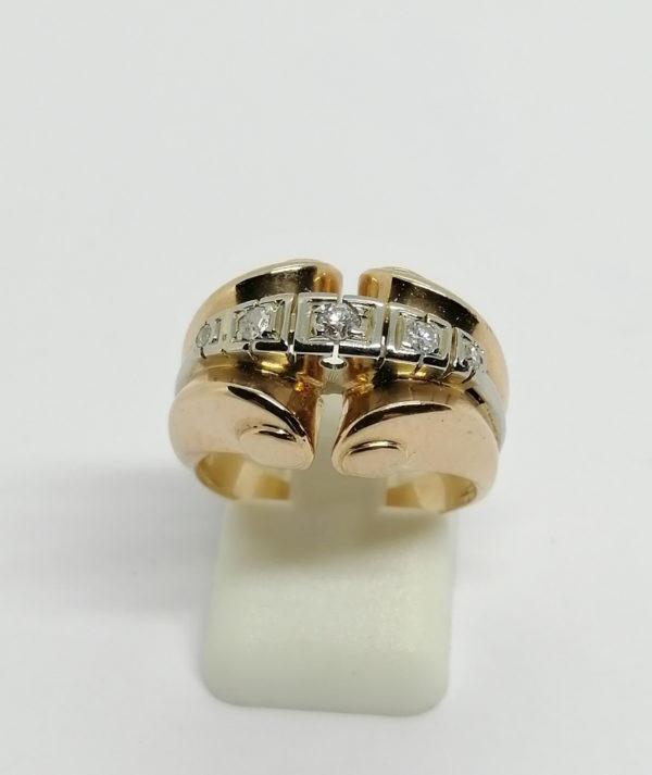 Bague en or, modèle bicolore sertie d'un rang de diamants, 1925.