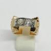 Bague en or, bicolore, modèle pont, sertie de deux gros diamants, 1925.