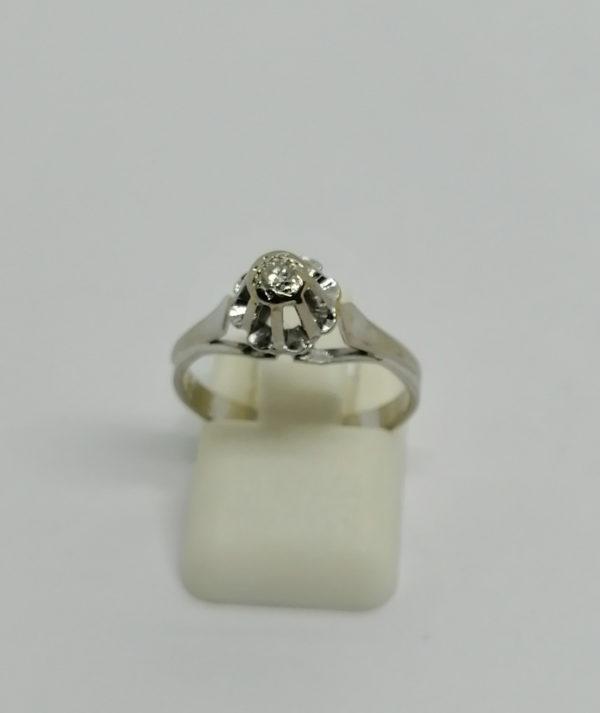 Bague en or gris, solitaire avec petit diamant, 1930-40.