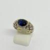 Bague argent , jonc travaillé avec pierre bleu en sertie clos.