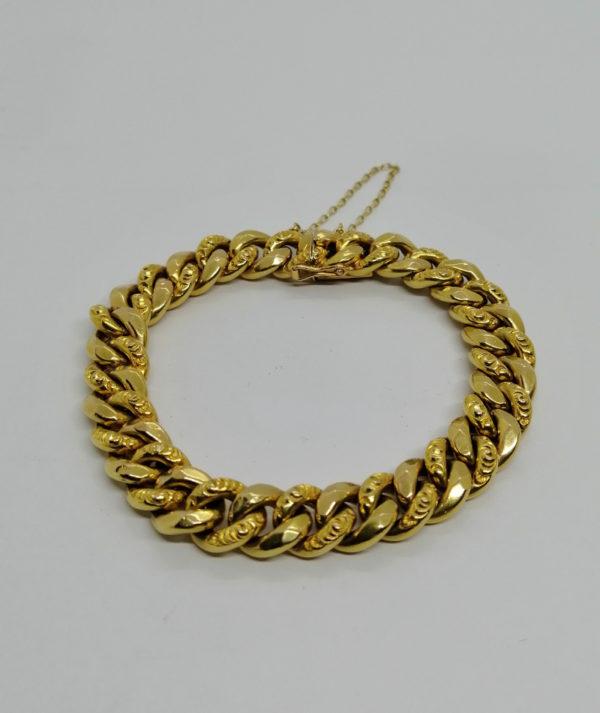 Bracelet en or jaune, maille gourmette creuse ouvragée, 1930.