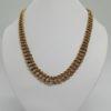 Collier maille gourmette travaillée, plaqué or, de marque Mûrat.