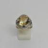 Bague argent, décor feuillage, et citrine ronde facettée, 1930-40.
