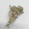 Broche argent, motif floral entièrement filigrané, vers 1920.
