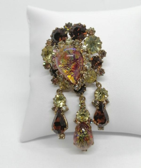 Broche strass façon opale et couleur jaune avec pampilles,