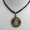 Pendentif argent, avec au centre une peinture émaillée d'un Pharaon.