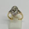 Bague or jaune, de forme ovale et ajourée, sertie de roses de diamants, 1925.