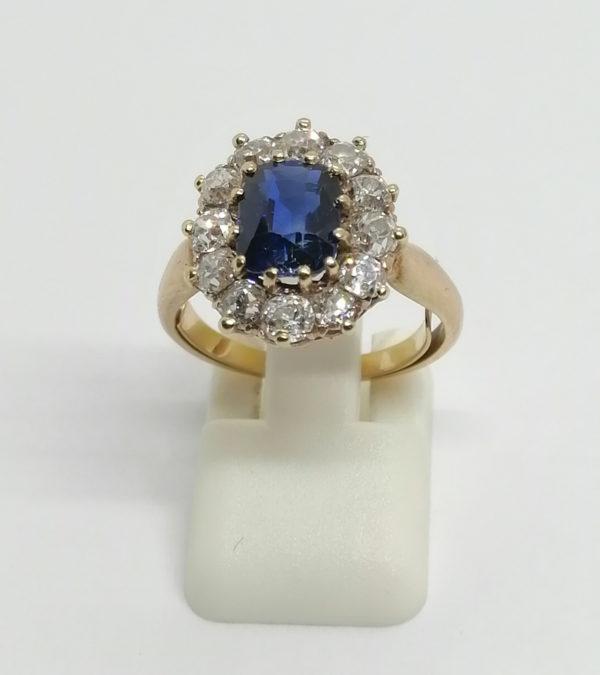 Bague en or jaune, marguerite avec saphir et diamants taille ancienne, vers 1925-30.