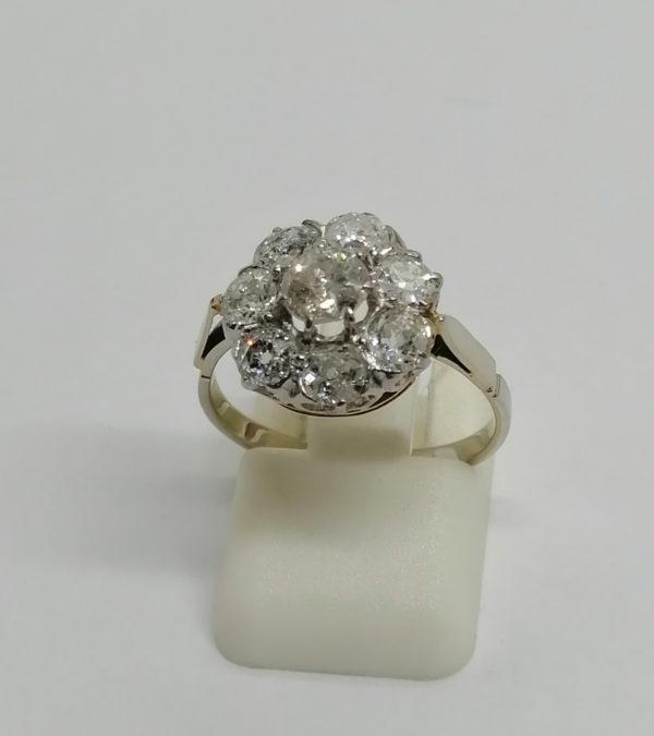 Bague or gris et sertie platine, marguerite de diamants de taille ancienne, 1900.